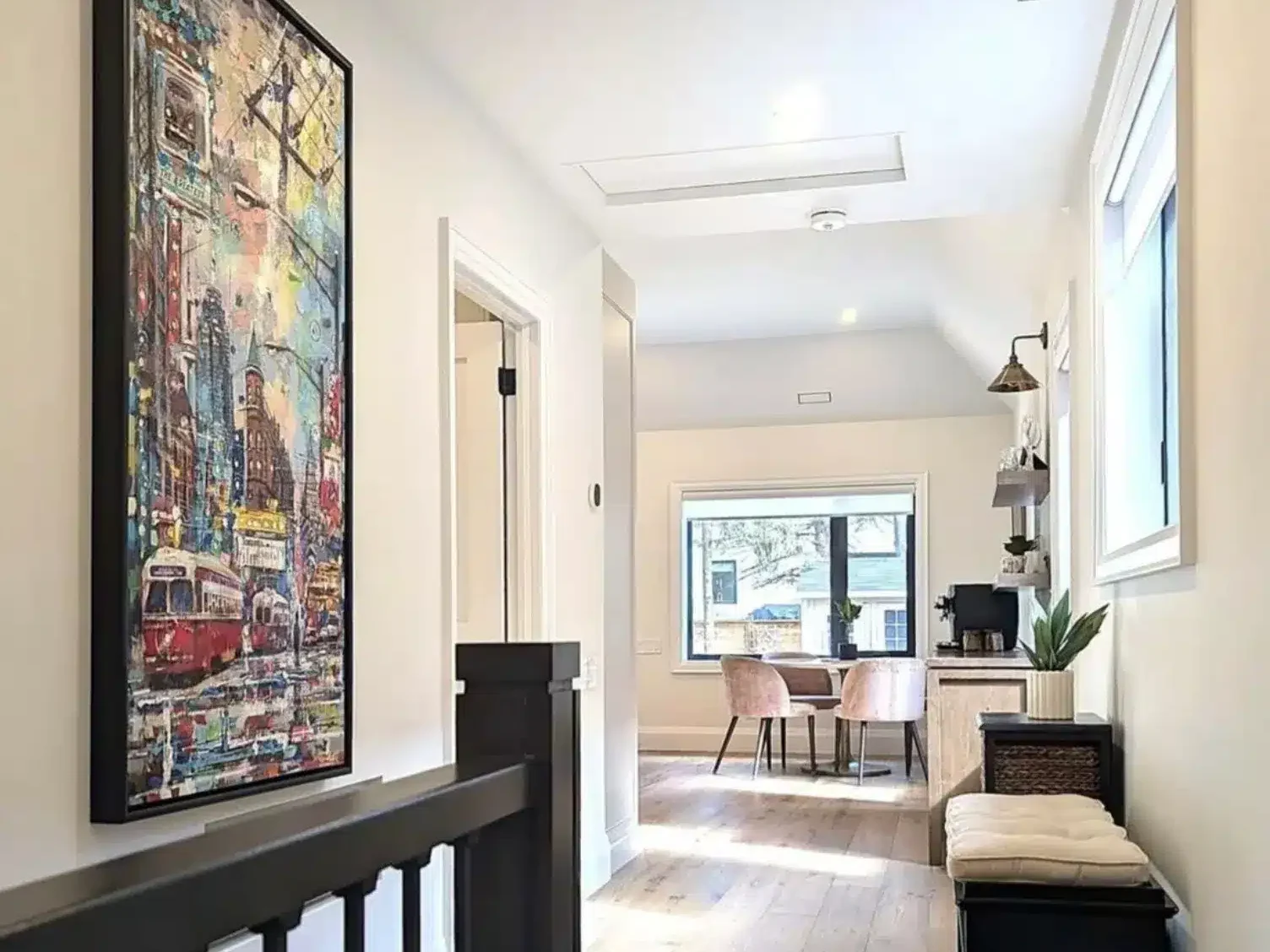 Finished modern interior hallway of a renovated Etobicoke home showing increased ceiling height and vaulted ceilings designed by a professional structural engineering firm.