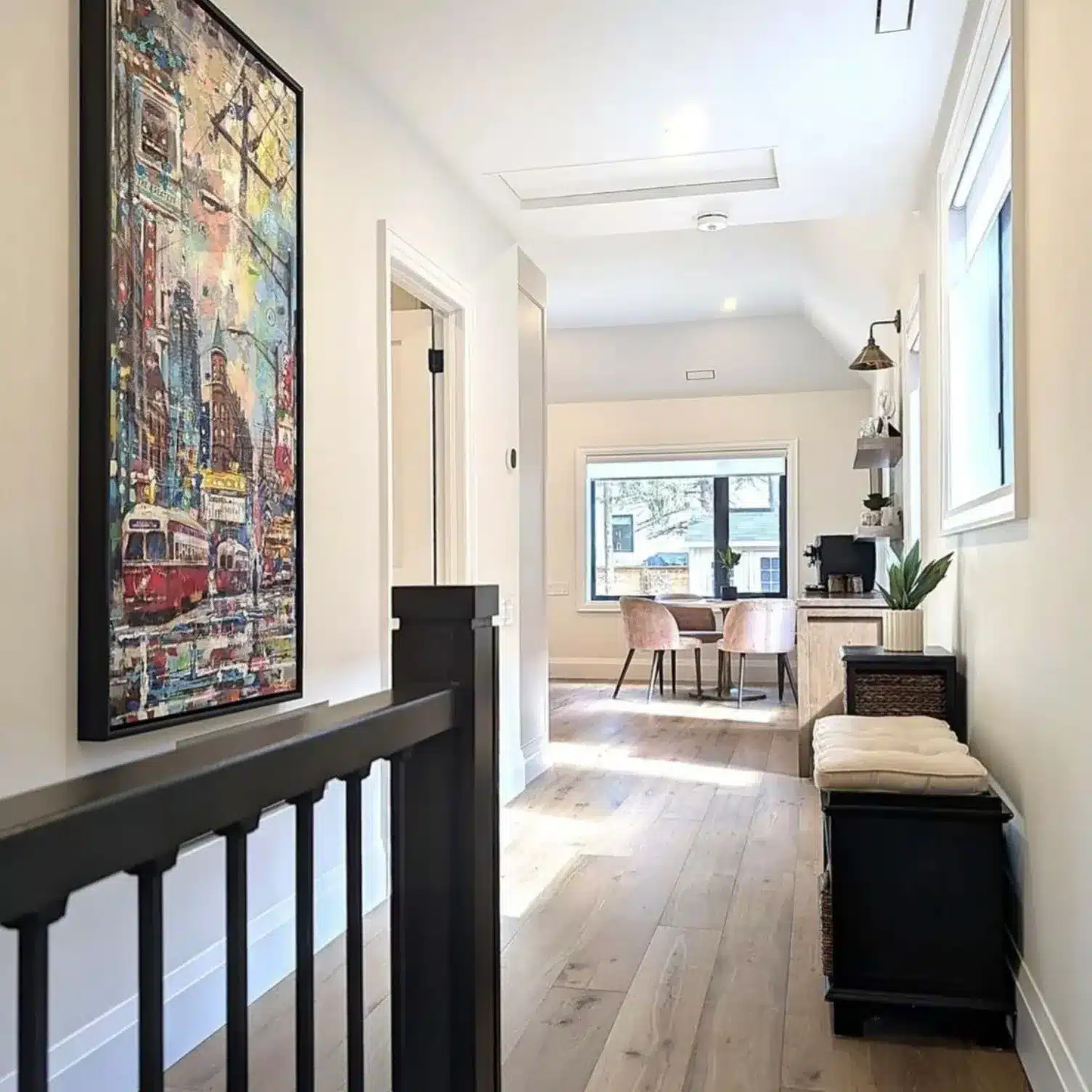 Finished modern interior hallway of a renovated Etobicoke home showing increased ceiling height and vaulted ceilings designed by a professional structural engineering firm.